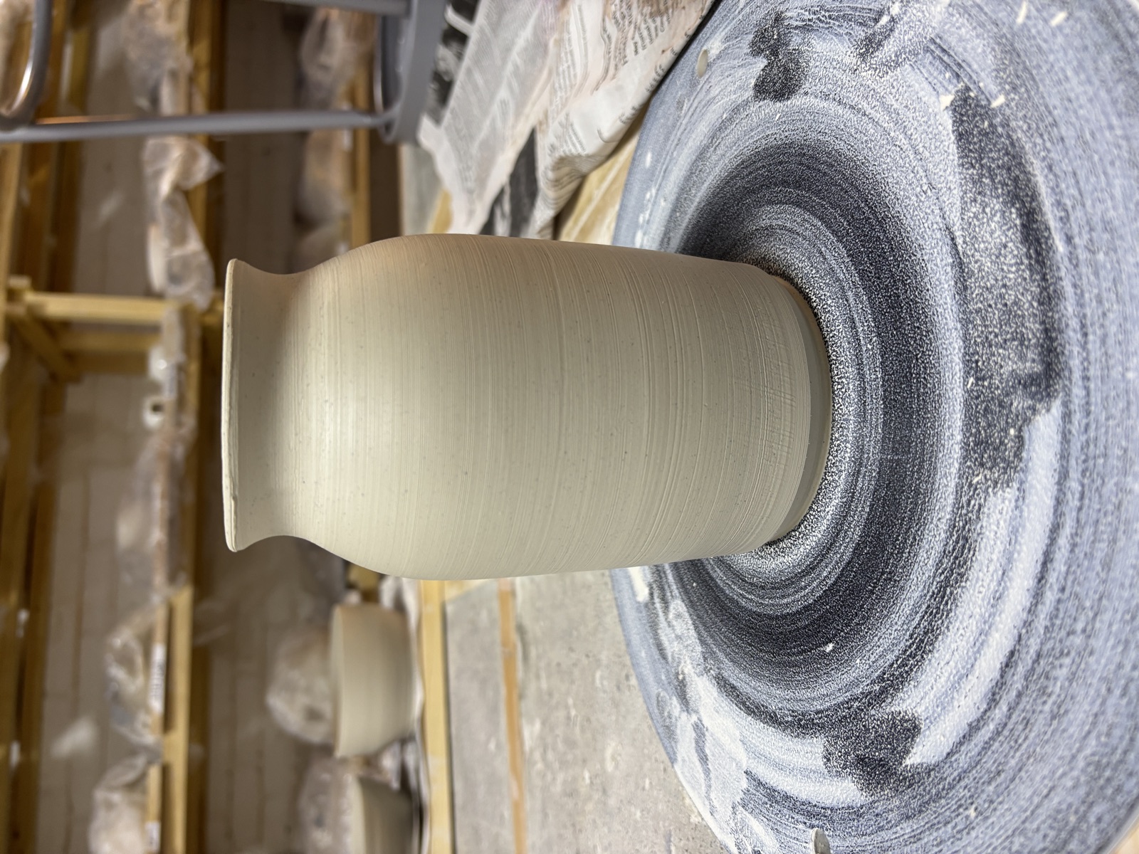 Tall vase freshly thrown on the wheel
